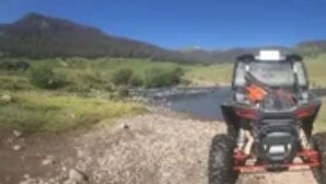 A dirt path leading to a vehicle. - Wet mountain  (Rye)