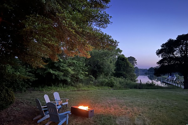 Relax by the water in comfortable Adirondack chairs