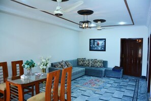 Deluxe Apartment | Living area | 32-inch LCD TV with cable channels, TV - Khyber Guest House (Swat)