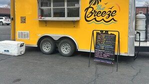 A yellow food truck with a menu board and a QR code. - Vernals Best Value Inn (Vernal)