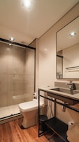 Shower, designer toiletries, hair dryer, towels