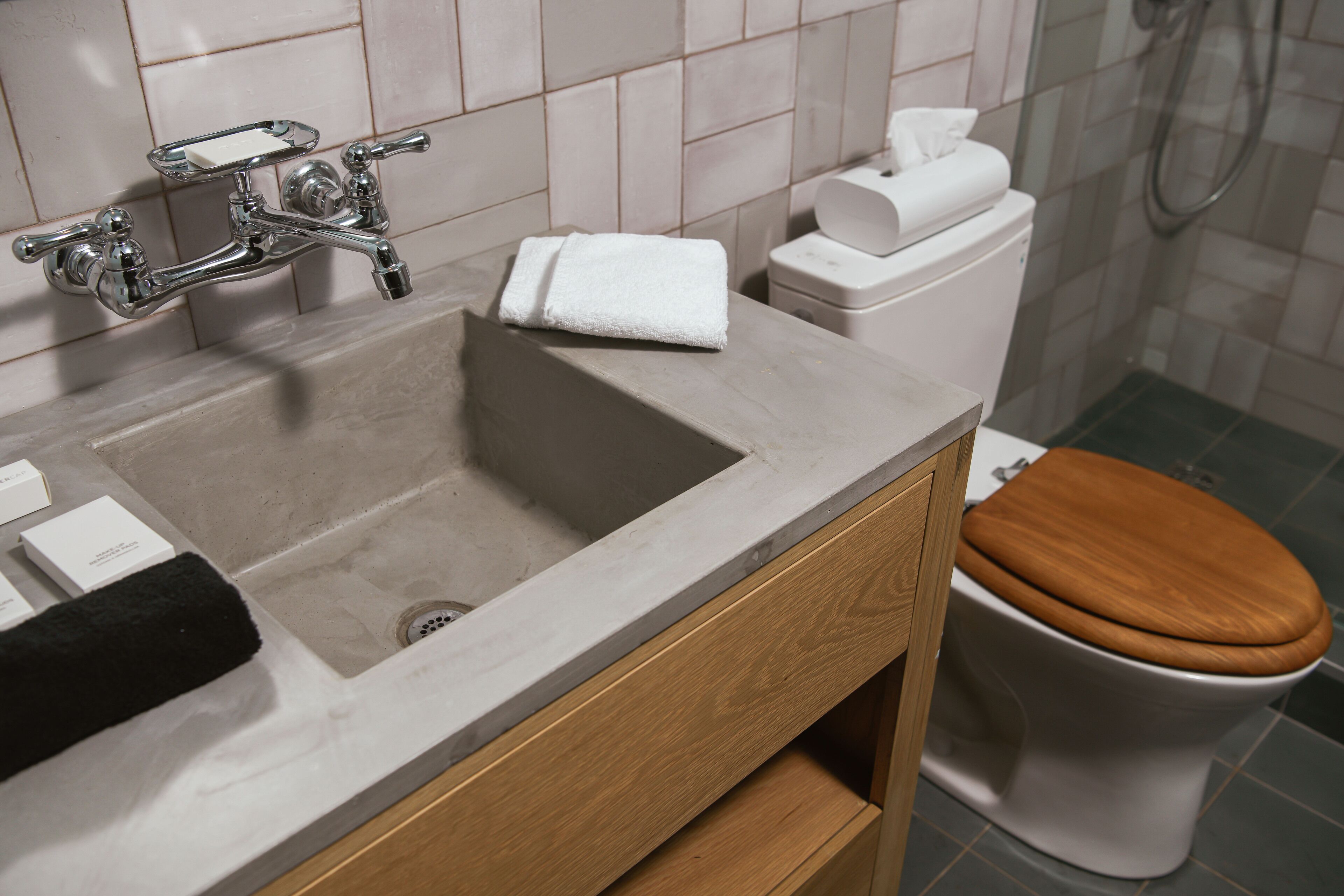 A bathroom with a sink, toilet, and shower.