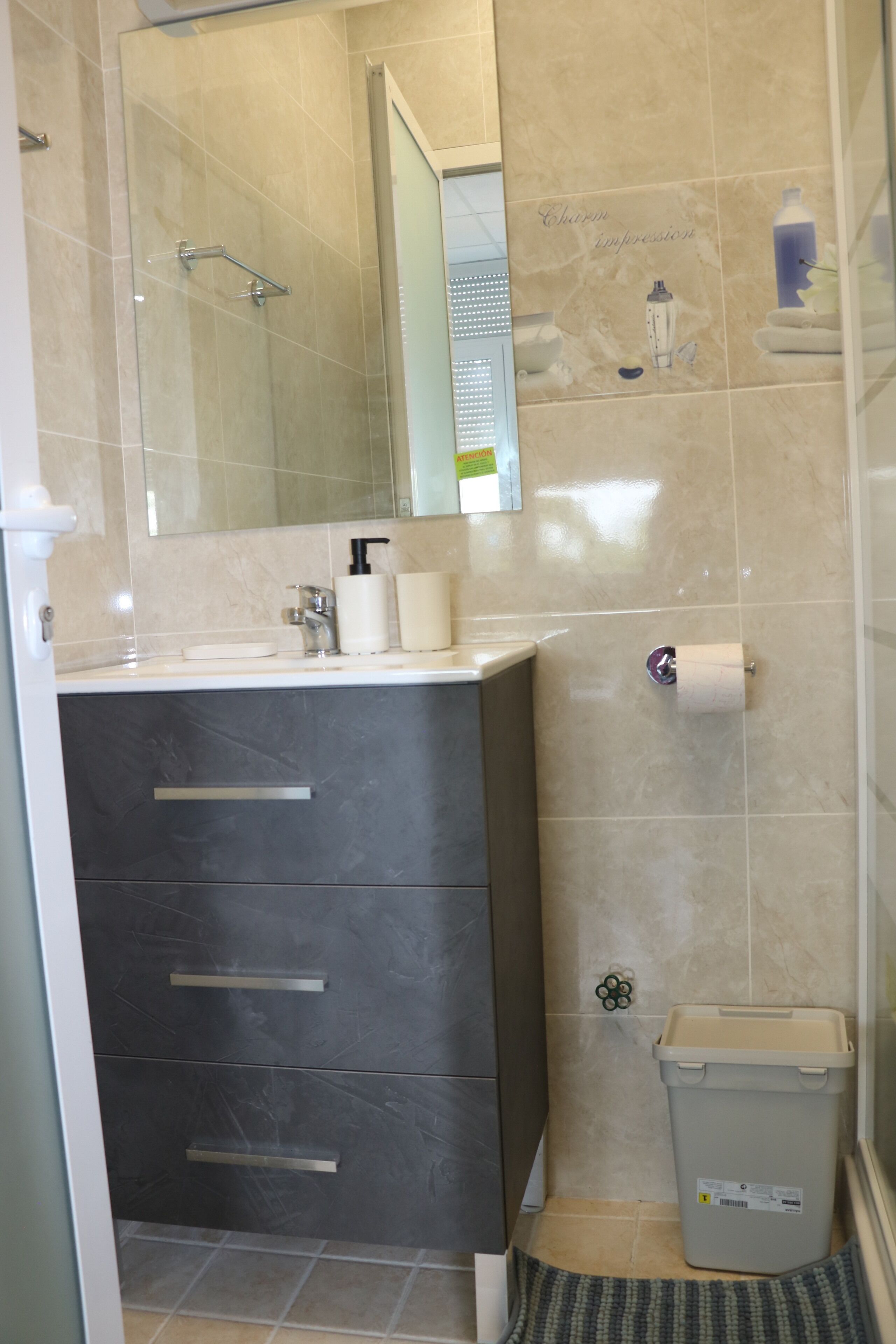 apartment | bathroom | shower, towels, shampoo, toilet paper