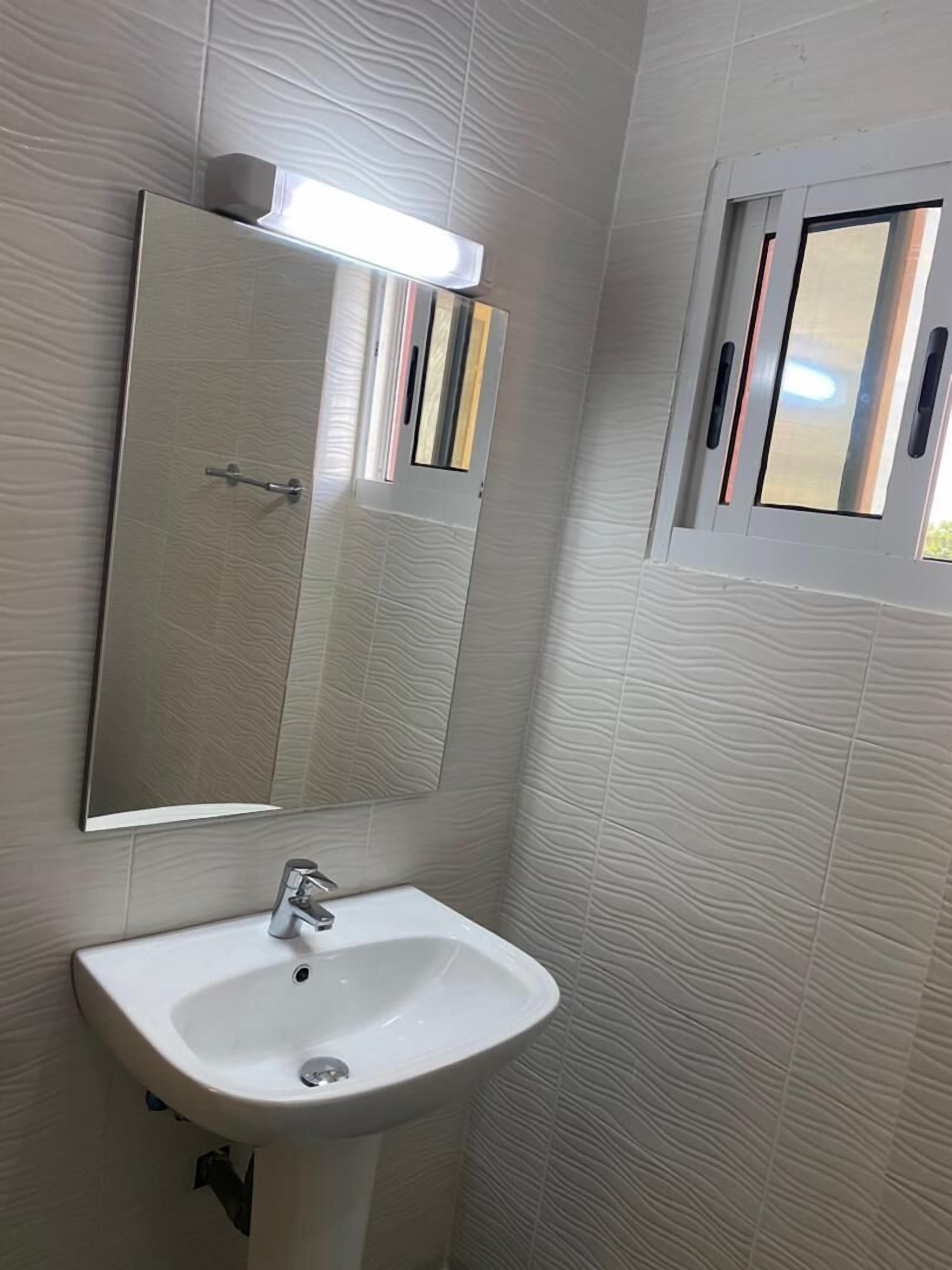 apartment | bathroom | shower, towels, shampoo, toilet paper