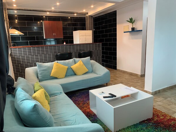 Comfort Apartment | Living area | 43-inch Smart TV with satellite channels