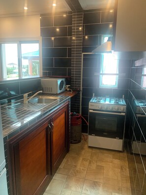 Comfort Apartment | Private kitchen | Mini-fridge, microwave, stovetop, toaster