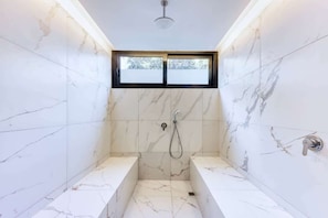Shower, hair dryer, towels, shampoo