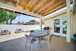 Enjoy al fresco dining and relaxation on this patio with a grill and seating for four.