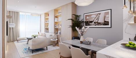 A modern living room with a sofa, coffee table, and dining area with chairs and a table.