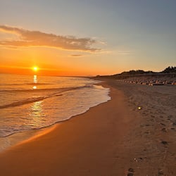 On the beach, sun-loungers, beach umbrellas, beach towels