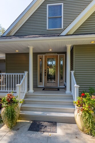 "Home Away From Home" nestled into five private acres on an all sports lake!