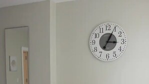 A bedroom with a bed, a wall clock, and two pillows with a motivational quote. - ★MODERN 1BR GREAT Location Downtown! W/D Parking!★ (Albany)