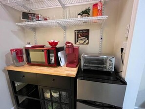 Microwave, coffee/tea maker, toaster, cookware/dishes/utensils