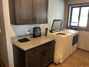 Convenient laundry facilities feature a washer and dryer.
