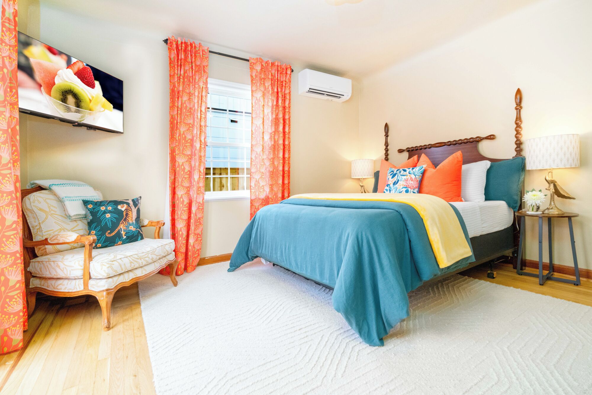 Bedroom One with Chair, TV, and AC / Heater