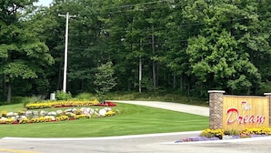 A landscaped entrance with a sign reading "The Dream."