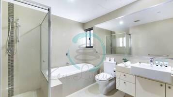 Luxury Condo | Bathroom | Separate bathtub and shower, free toiletries, hair dryer, towels