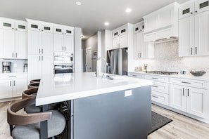 A huge kitchen island dominates this brand new chefs kitchen.  We have stocked the kitchen with just about everything you could possibly need.