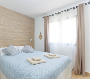 1 bedroom, desk, iron/ironing board, travel crib