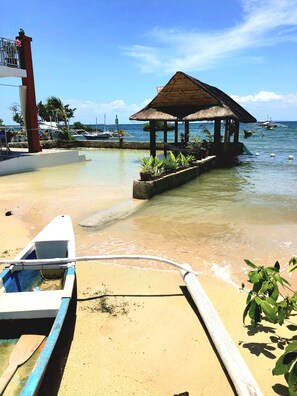 On the beach, sun loungers, beach towels