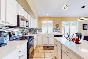 Fridge, microwave, oven, stovetop - Dog-friendly home with pool, grill, office, enclosed backyard, & fireplace (Gilbert)