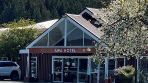 A hotel with a modern design, large windows, and a sign that reads "AWA HOTEL". - AWA Hotel (Rotorua)