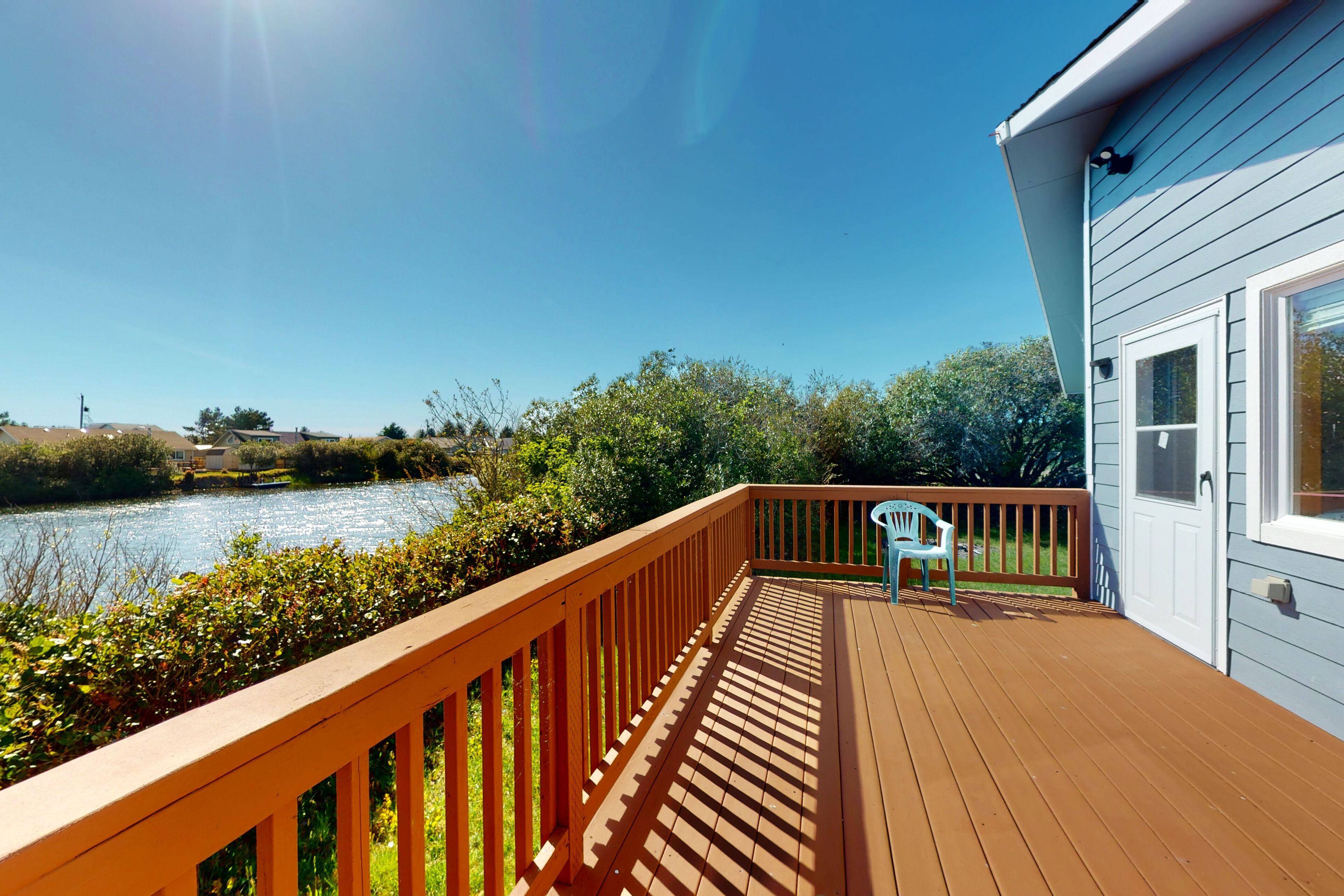 Water view home with a wood stove, patio, and washer/dryer and dog-friendly
