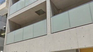 A multi-story building with a commercial space on the ground floor labeled "SALON". - SALON Shibuya 4B (Tokyo)