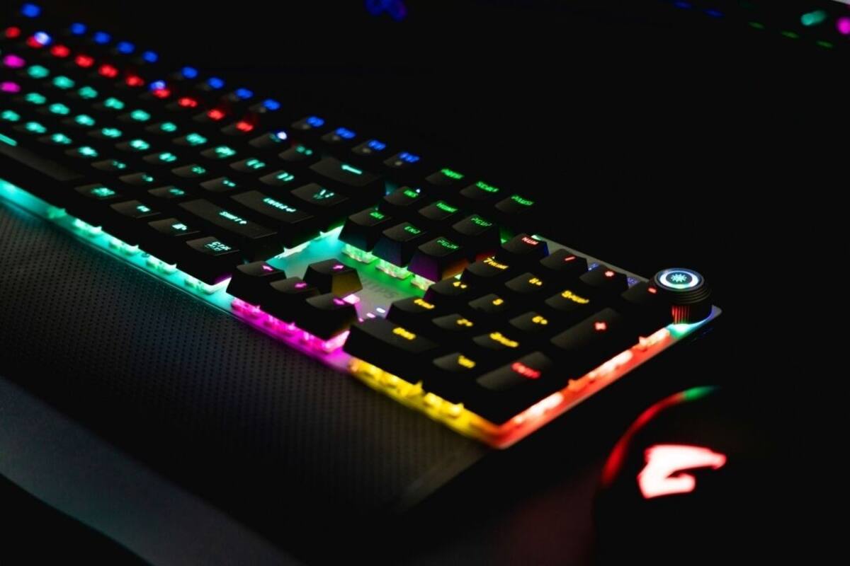 A close-up of a mechanical keyboard with RGB lighting.