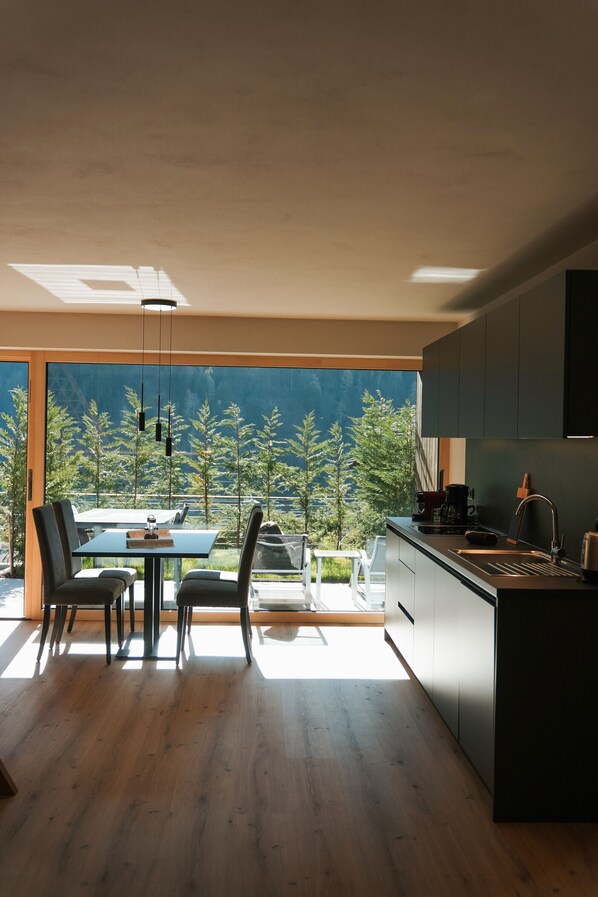 Fridge, stovetop, dishwasher, coffee/tea maker