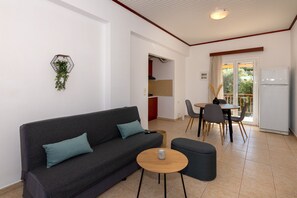 Apartment, 2 Bedrooms, Balcony | Living area | 40-inch flat-screen TV with cable channels, TV, Netflix