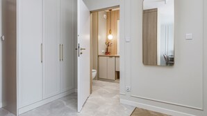 A modern bathroom with a toilet, sink, and mirror. - Elegant Apartment on Salt Island | Parking | Balcony (Kolobrzeg)
