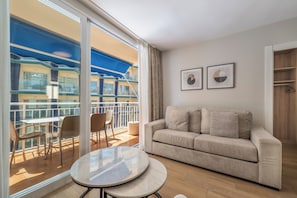Family Apartment, 3 Bedrooms | Living area | Flat-screen TV