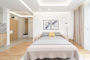 Deluxe-Apartment | Wohnbereich | 40-Zoll-LCD-Fernseher mit Kabelempfang, Fernseher