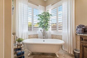 Bathtub, hair dryer, towels