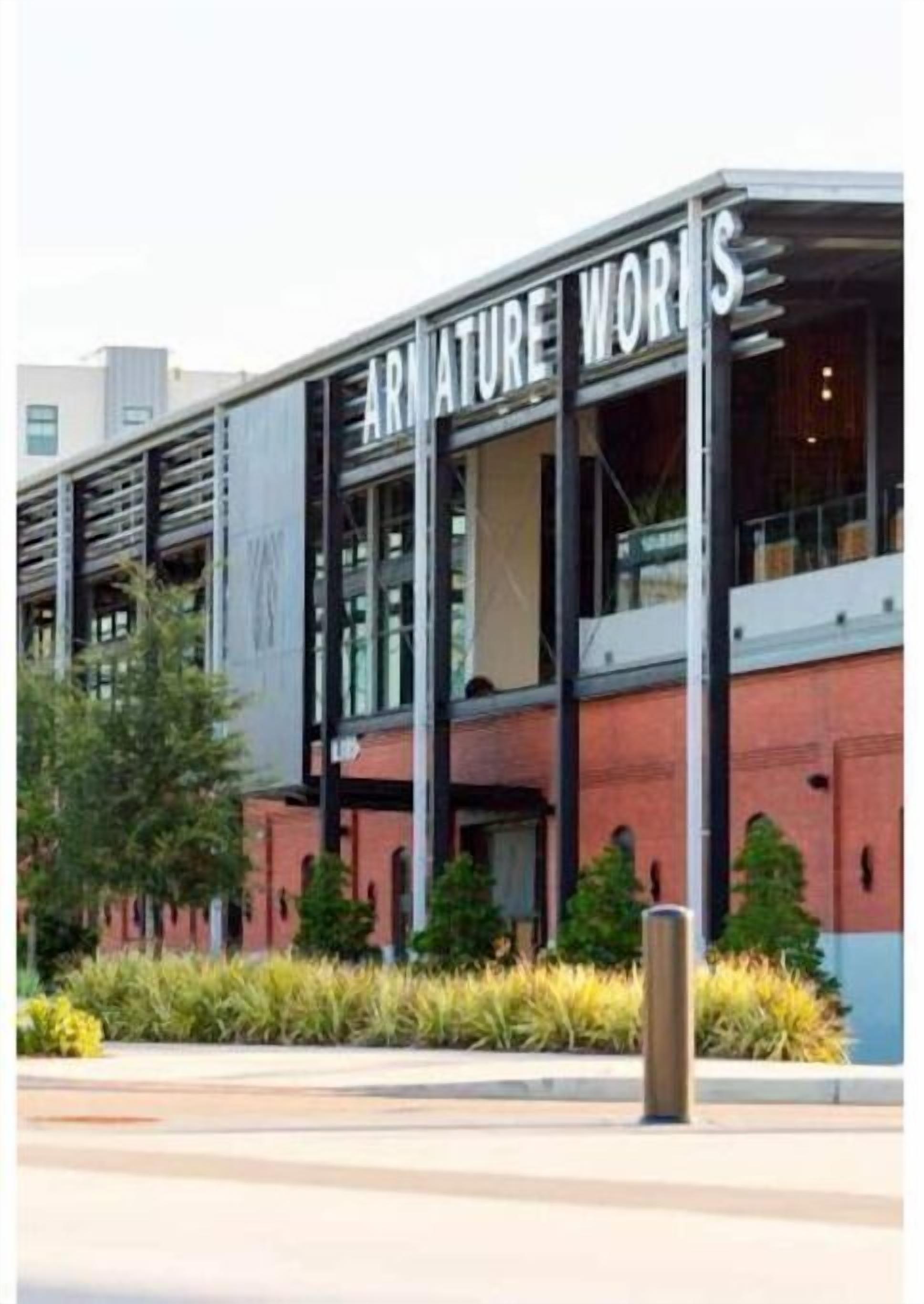 A building with the sign "ARMATURE WORKS" on the facade.