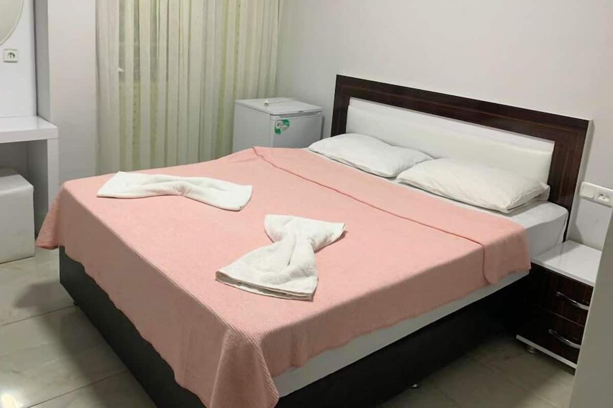 1 bedroom, desk, laptop workspace, bed sheets