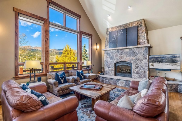 Living room with mountain views and gas fireplace