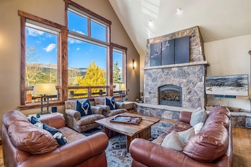 Living room with mountain views and gas fireplace