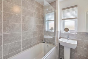 Bathtub, hair dryer, towels, soap