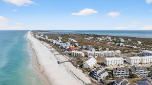 An aerial view of a coastal residential area with beachfront properties and a beach. - Community Pool, 3bdrm (Cape San Blas)