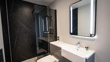 Shower, hair dryer, bathrobes, towels