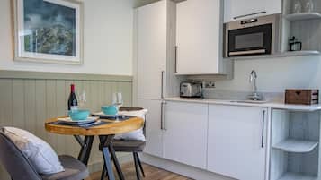 Fridge, microwave, toaster, cookware/dishes/utensils