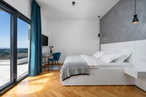 A modern bedroom with a bed, a desk, and a chair. - Villa Fortress, private pool, Game room, sea views (Klis)