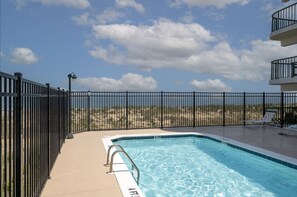 Enjoy a refreshing swim with a view of the beach and dunes from our pool area.