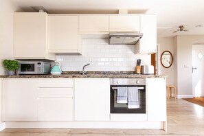 Fridge, microwave, oven, dining tables