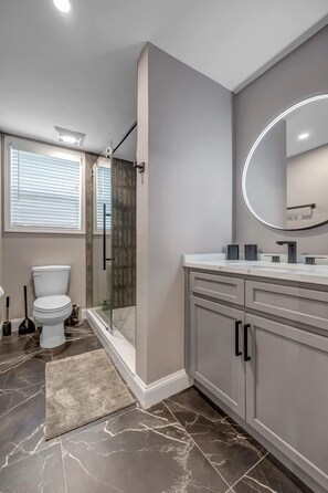 Shower, hair dryer, towels, shampoo