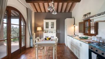Villa | Private kitchen | Full-sized fridge, microwave, oven, dishwasher