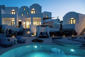 A modern villa with a swimming pool, outdoor seating, and a staircase leading to the upper levels. - CUORE SANTO SUITES (Santorini)