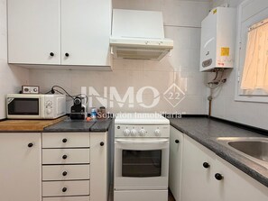 Fridge, microwave, coffee/tea maker, cookware/dishes/utensils